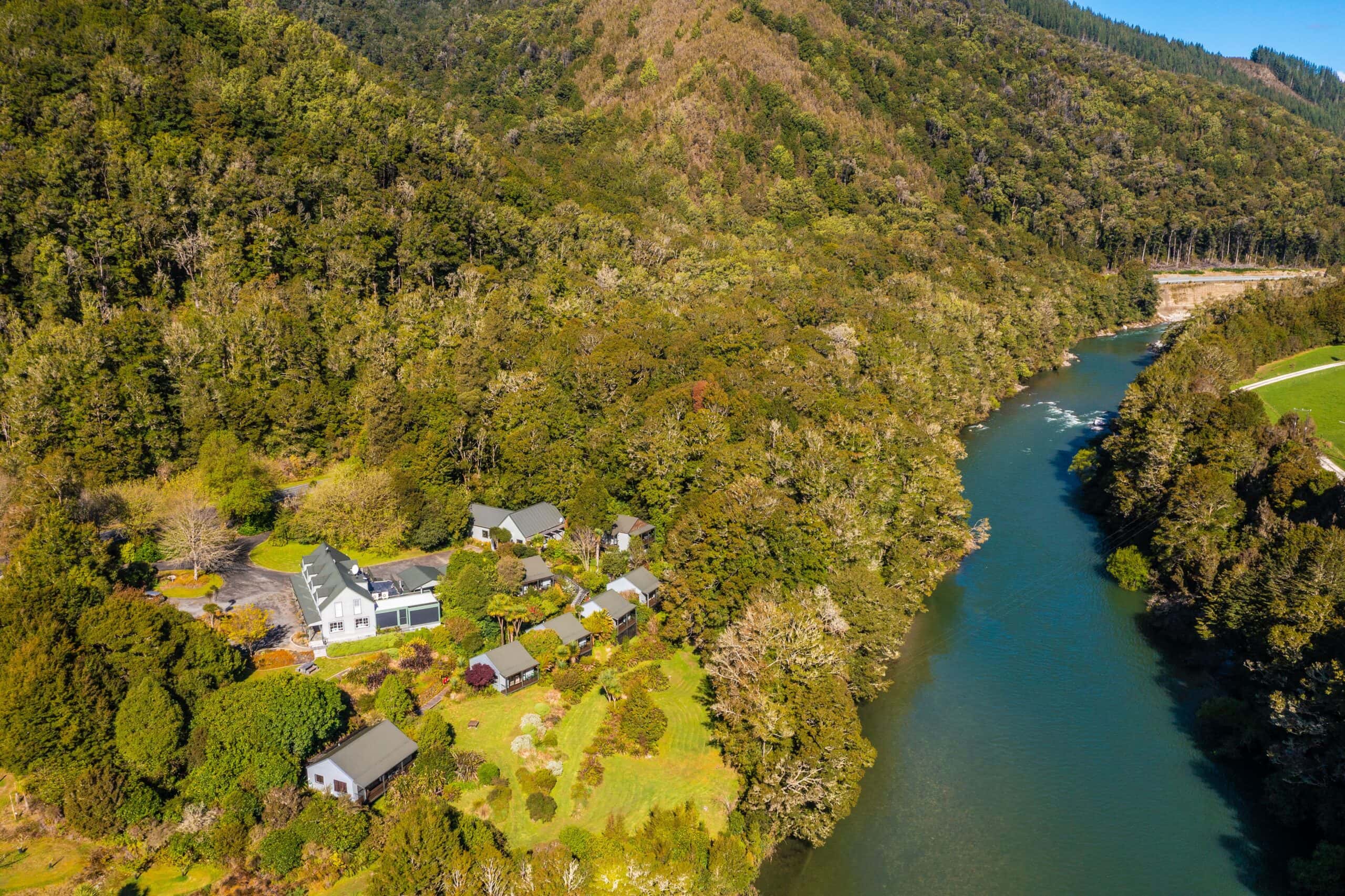 Aeriela view of the retreat next to a river